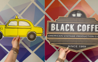 Picture of a cutout yellow car sign and a black, cutout sign for a coffee shop, two creative sign ideas.