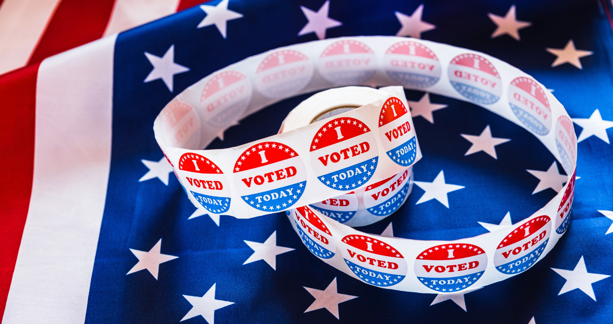 Stickers that say "I voted" on top of an American flag, popular political campaign materials